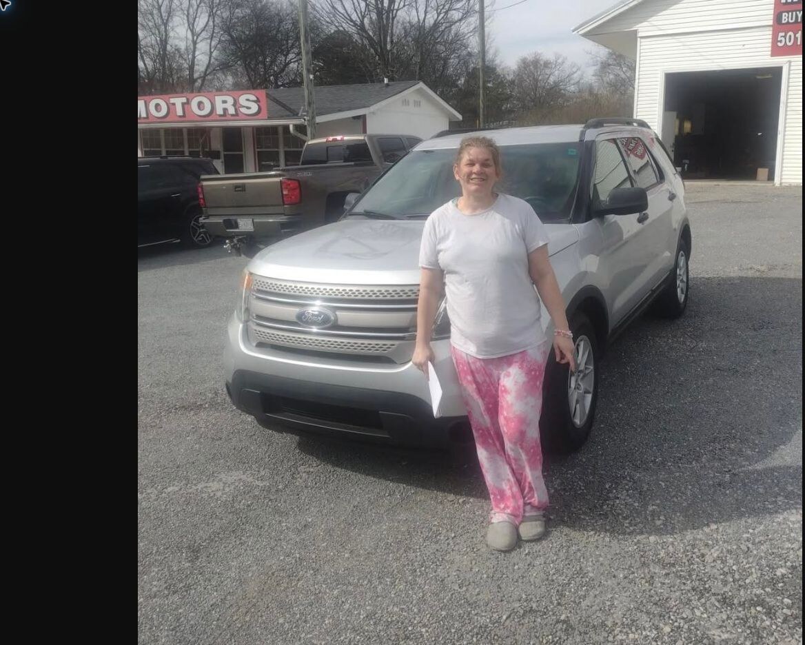 Amber with her Ford Explorer purchased from TMT Motors