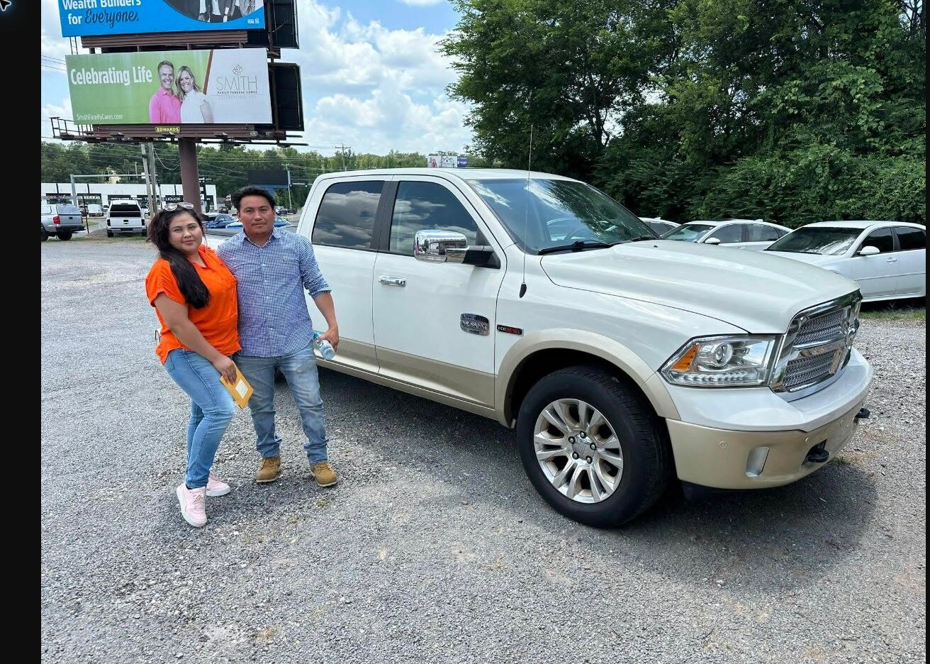 Carlos and Luna with their Ram 1500 EcoDiesel purchased from TMT Motors