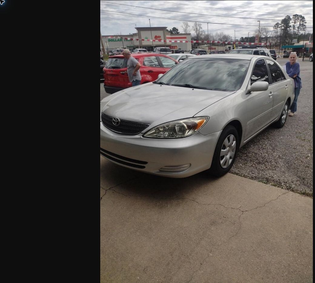 Carrie with her vehicle purchased from TMT Motors
